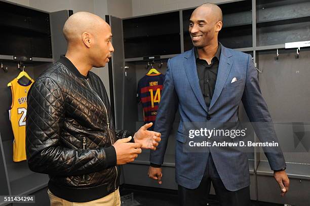 Thierry Henry and Kobe Bryant of the Los Angeles Lakers talk in the locker room before the game against the San Antonio Spurs on February 19, 2016 at...