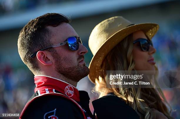 Austin Dillon, driver of the Rheem Chevrolet, stands on the grid with his girlfriend, Whitney Ward, prior to the NASCAR XFINITY Series PowerShares...