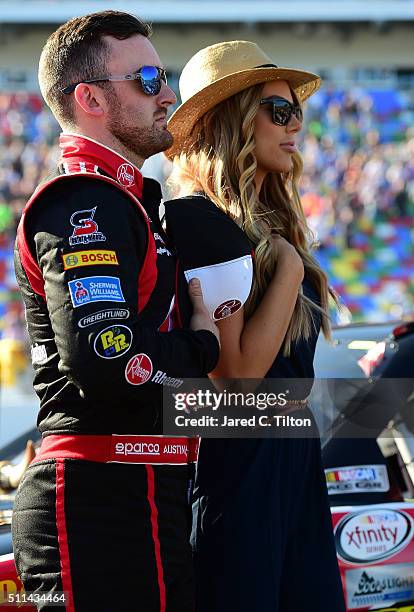 Austin Dillon, driver of the Rheem Chevrolet, stands on the grid with his girlfriend, Whitney Ward, prior to the NASCAR XFINITY Series PowerShares...