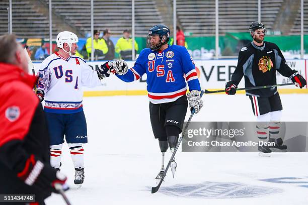 The Chicago Blackhawks and the Wounded Warriors hockey team skate during practice day for the 2016 Coors Light Stadium Series game against the...