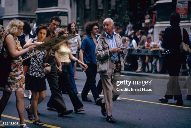 French photographer Henri Cartier-Bresson covers a street demonstration, 1971.