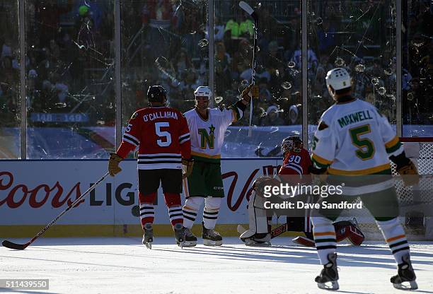Darby Hendrickson of the Minnesota Wild/North Stars reacts after a goal by teammate Dennis Maruk during the 2016 Coors Light Stadium Series Alumni...