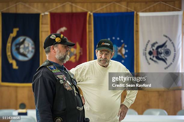 Michael Rabun chats with a fellow Republican primary voter at a polling location, American Legion Post 90, on February 20, 2016 in West Columbia,...