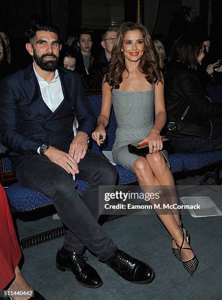 Adrien Koskas and Cheryl Fernandez-Versini attend the Gareth Pugh show during London Fashion Week Autumn/Winter 2016/17 at on February 20, 2016 in...