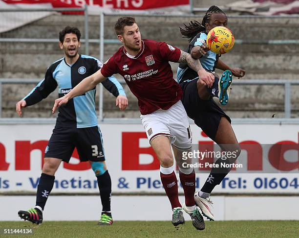 James Collins of Northampton Town contests the ball with Marcus Bean of Wycombe Wanderers during the Sky Bet League Two match between Northampton...