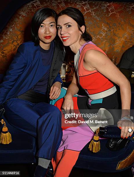 Mimi Xu and Lara Bohinc attend the Marc Jacobs Beauty dinner at the Club at Park Chinois on February 20, 2016 in London, England.