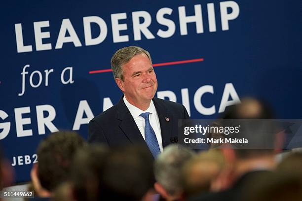 Jeb Bush reacts as he announces the suspension of his presidential campaign at an election night party at the Hilton Columbia Center in Columbia, SC...