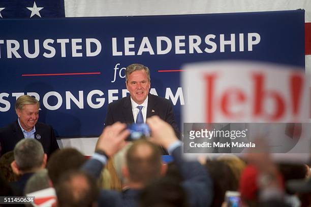 Jeb Bush takes the stage before announcing the suspension of his presidential campaign at an election night party at the Hilton Columbia Center in...