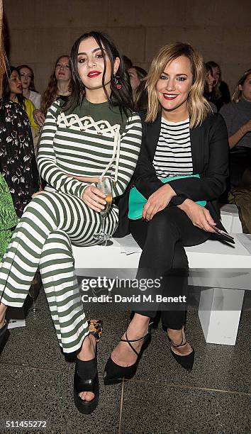 Charli XCX and Caroline Flack attend the House of Holland show during London Fashion Week Autumn/Winter 2016/17 at TopShop Show Space on February 20,...