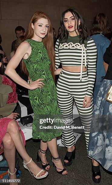 Nicola Roberts and Charli XCX attend the House of Holland show during London Fashion Week Autumn/Winter 2016/17 at TopShop Show Space on February 20,...