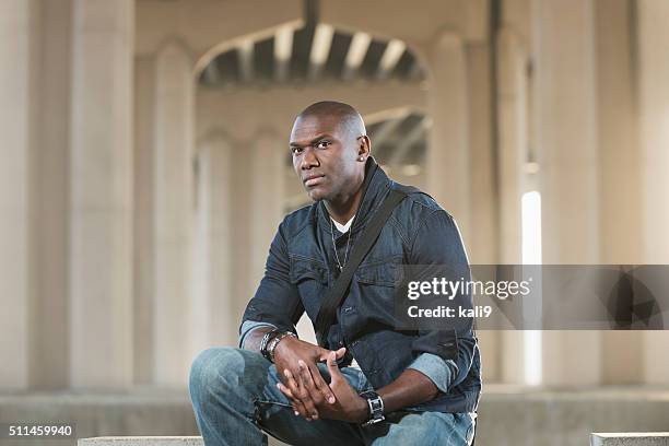 black man with shaved head wearing jewelry and denim - all hip hop models stock pictures, royalty-free photos & images