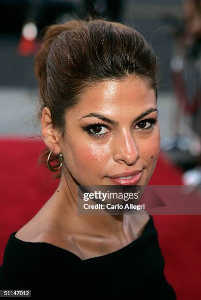 Actress Eva Mendes poses as she arrives at the Premiere of "We Don't Live Here Anymore" at the Director's Guild Theatre on August 5, 2004 in Los...