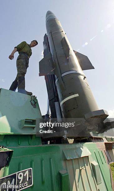 Russian soldier stands on the launcher of the tactical missile " Point-M" prior to its training launch near Kaliningrad on the Baltic Sea, 05 July...