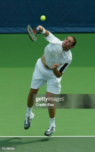 Mardy Fish of the USA returns a shot to Gregory Carraz of France during the RCA Tennis Championships on July 21, 2004 at the Indianapolis Tennis...