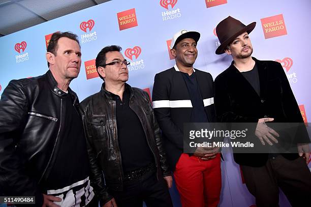 Musicians Roy Hay, Jon Moss, Mikey Craig and Boy George of Culture Club pose backstage during the first ever iHeart80s Party at The Forum on February...