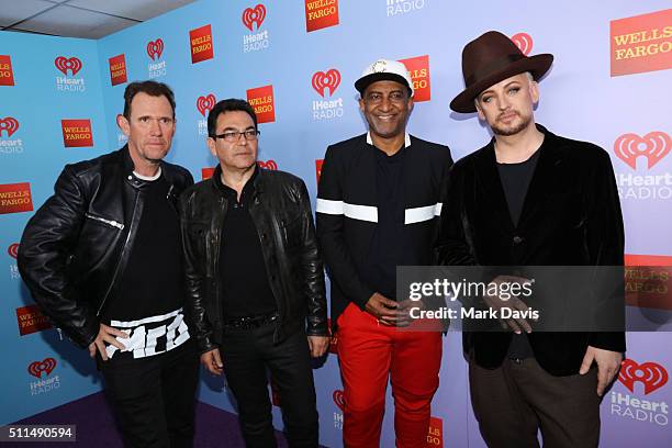 Recording artists Roy Hay, Jon Moss, Mikey Craig, and Boy George of music group Culture Club pose backstage during the first ever iHeart80s Party at...