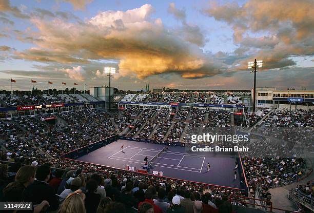 The sun sets as Anastasia Myskina of Russia plays Magdalena Maleeva of Bulgaria during the quarterfinals of the Rogers Cup tennis on August 6, 2004...