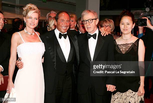 Singer Paul Anka , his wife and filmmaker Woody Allen and his wife Soon-Yi arrive at the Monte Carlo Red Cross Ball 2004 held at the Salle des...