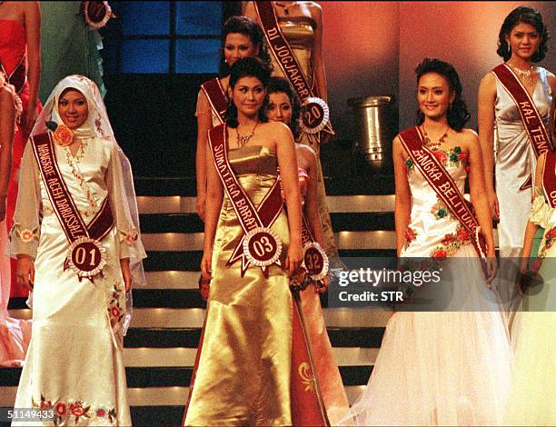 Indonesian Andina Agustina poses along with other contestants of Miss Indonesia 2004 at Jakarta 06 August 2004. The 18-year-old Acehnese native...