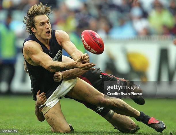 Anthony Koutoufides for the Blues in action during the round nineteen AFL match between The Essendon Bombers and the Carlton Blues at the M.C.G. On...