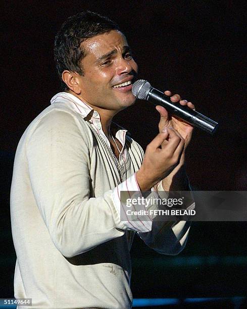 Egyptian singer Amro Diab performs late 06 August 2004 during the Carthage international festival in the Roman theatre. AFP PHOTO/FETHI BELAID