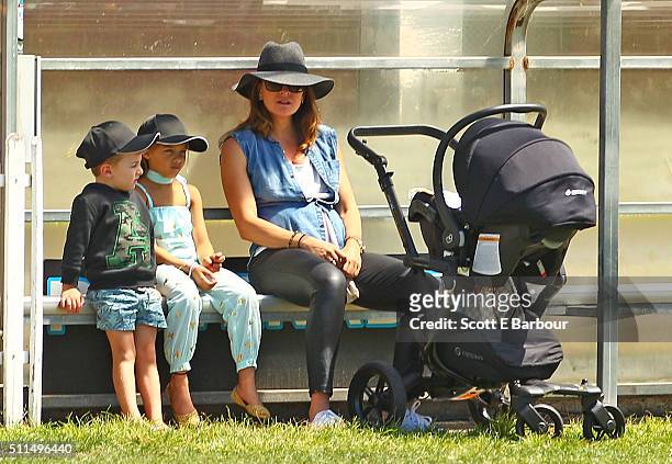 Michelle Bridges with her baby Axel in his pram looks on with Ella and Jack, the children of Steve Willis, also known as The Commando during the...