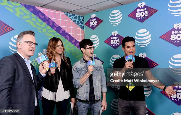 IiHeartRadio personalities Sean Valentine, Jillian Escoto, Kevin Manno, and Mario Lopez speak backstage during the first ever iHeart80s Party at The...