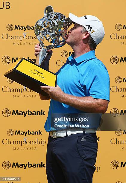 Marcus Fraser of Australia celebrates with the trophy after winning the fourth round of the Maybank Championship Malaysia at Royal Selangor Golf Club...