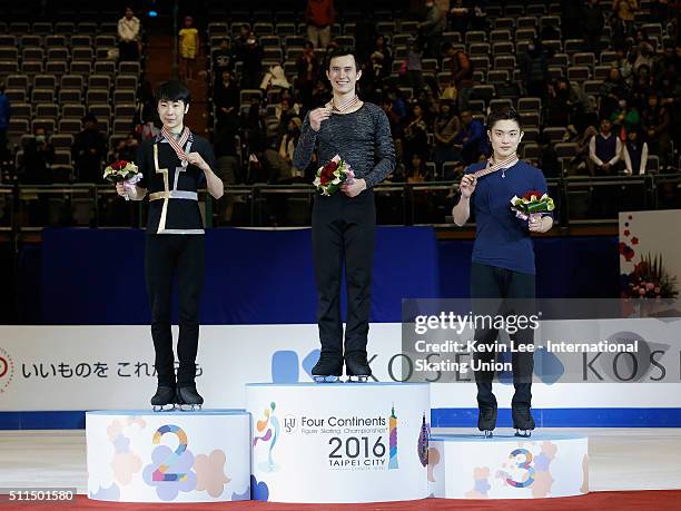 Silver medallist Boyang Jin of China, Gold medallist Patrick Chan of Canada, and Bronze medallist Han Yan of China pose for a picture on the podium...