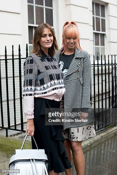 Supermodel Yasmin Le Bon who wears a Markus Lupfer top and trousers and Alexander Wang shoes with model Amber Le Bon who wears an Anna Sui coat,...