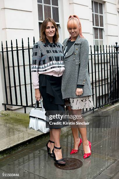 Supermodel Yasmin Le Bon who wears a Markus Lupfer top and trousers and Alexander Wang shoes with model Amber Le Bon who wears an Anna Sui coat,...