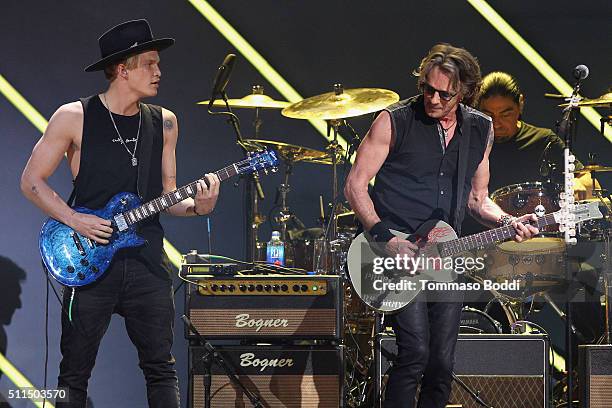 Recording artists Cody Simpson and Rick Springfield perform on stage during the iHeart80s Party 2016 at The Forum on February 20, 2016 in Inglewood,...