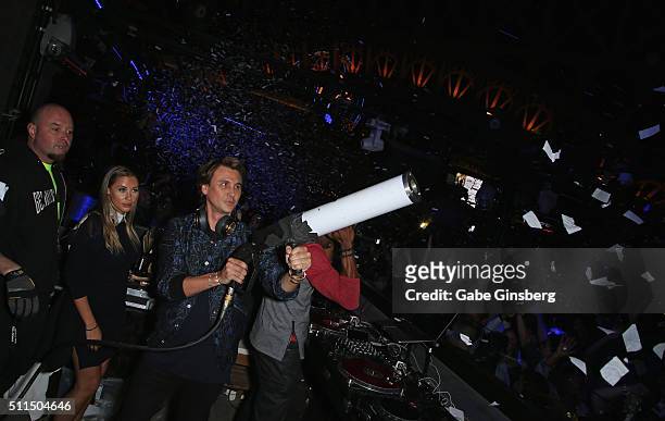 Anat Popovsky watches reality star Jonathan Cheban shoot a confetti canon at the Chateau Nightclub & Rooftop at the Paris Las Vegas to celebrate...