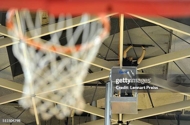 Worker tapes a leak in a water pipe in the ceiling prior to the Beko BBL TOP FOUR Third Place Game between Brose Baskets and FRAPORT Skyliners at...
