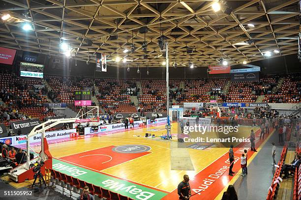 Officials stand on the court underneath a leak in a water pipe in the ceiling prior to the Beko BBL TOP FOUR Third Place Game between Brose Baskets...