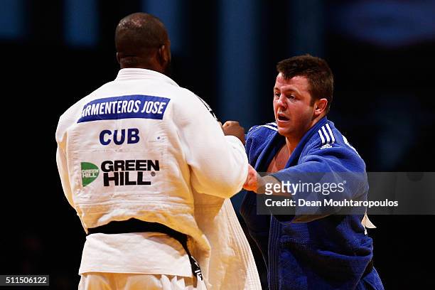 Benjamin Fletcher of Great Britain and Jose Armenteros of Cuba compete during the Dusseldorf Judo Grand Prix in their Mens -100kg bout held at...