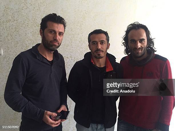Turkey's semi-official news agency, Anadolu Agency journalists , Onur Coban, Kenan Yesilyurt and Rauf Maltas pose at the district's police...