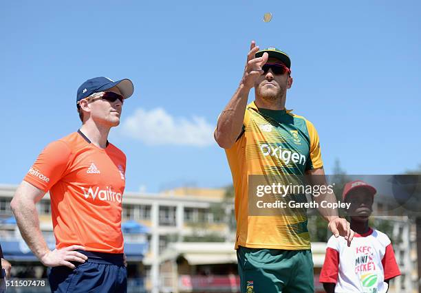 South Africa captain Faf du Plessis tosses the coin alongside England captain Eoin Morgan ahead of the 2nd KFC T20 International match between South...