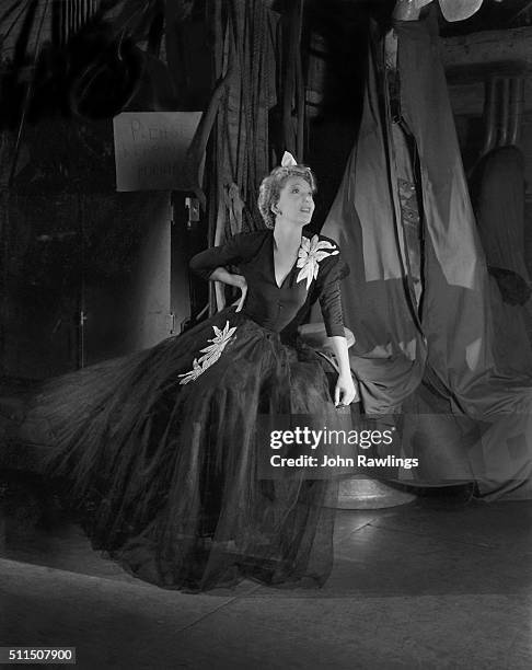 Actress Gertrude Lawrence wearing a Gertrude Lawrence Fashions dress, marketed to benefit wartime agencies.