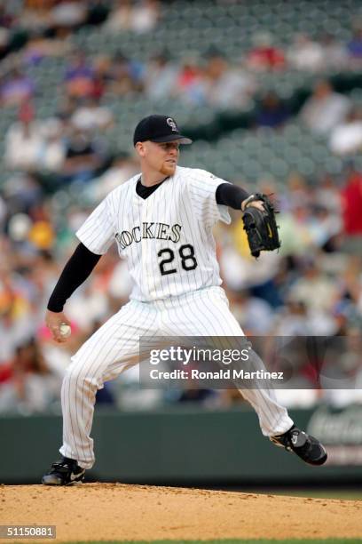 Starting pitcher Aaron Cook of the Colorado Rockies throws against the Cincinnati Reds on August 7, 2004 at Coors Field in Denver, Colorado.