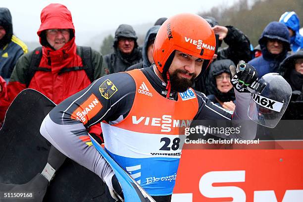Andi Langenhan of Germany reacts after heat two of the Men's event of the Viessmann Luge World Cup Day 2 at Veltins Eis-Arena on February 20, 2016 in...