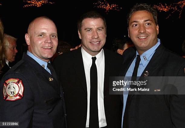 Firefighters and NY Rescue Workers Detoxication Project spokesmen Joe Higgins , Sebastian Raspanti and actor John Travolta attend the Church of...