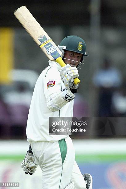 Graeme Smith celebrates a half century during the fifth day of the first Test match between Sri Lanka and South Africa on August 8, 2004 at the...