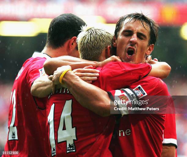 Alan Smith of Manchester United celebrates scoring the second goal of the game with John O'Shea and Gary Neville during the Community Shield match...