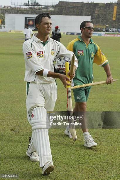 Jacques Rudolph and Nicky Boje leave the field during the fifth day of the first Test match between Sri Lanka and South Africa on August 8, 2004 at...