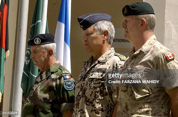 Canadian Lieutenant General Rick Hillier , NATO Joint Force Command Commander, Gerhard Back, and French Lieutenant General Jean-Louis Py , stand...