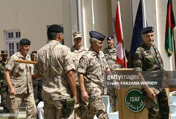 Canadian General Rick Hillier and NATO Joint Force Command Commander Gerhard Back follow Commander of Eurocorps French Lieutenant General Jean-Louis...