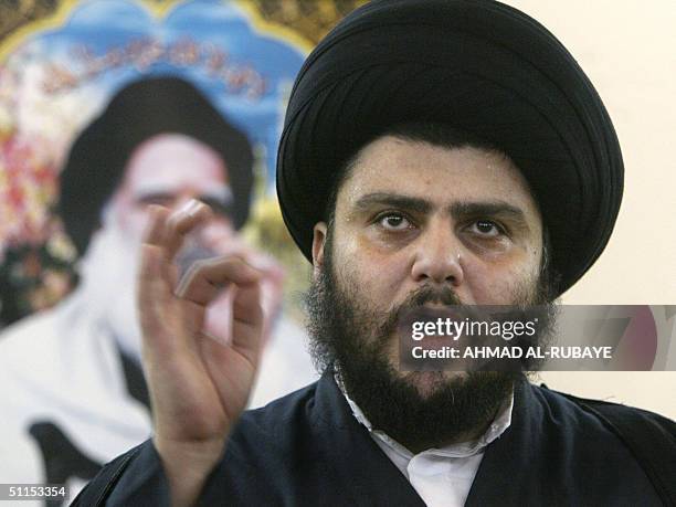 Iraqi Shiite Muslim radical cleric Moqtada Sadr gives a press conference at the shrine of Imam Ali in the holy city of Najaf 09 August 2004. Sadr...