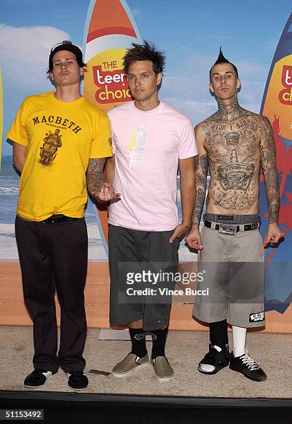 Tom DeLonge, Mark Hoppus and Travis Barker of Blink 182 pose backstage at The 2004 Teen Choice Awards held at Universal Amphitheater on August 8,...