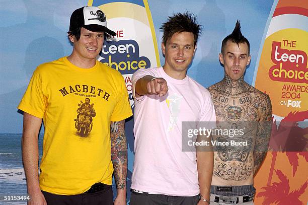 Tom DeLonge, Mark Hoppus and Travis Barker of Blink 182 pose backstage at The 2004 Teen Choice Awards held at Universal Amphitheater on August 8,...